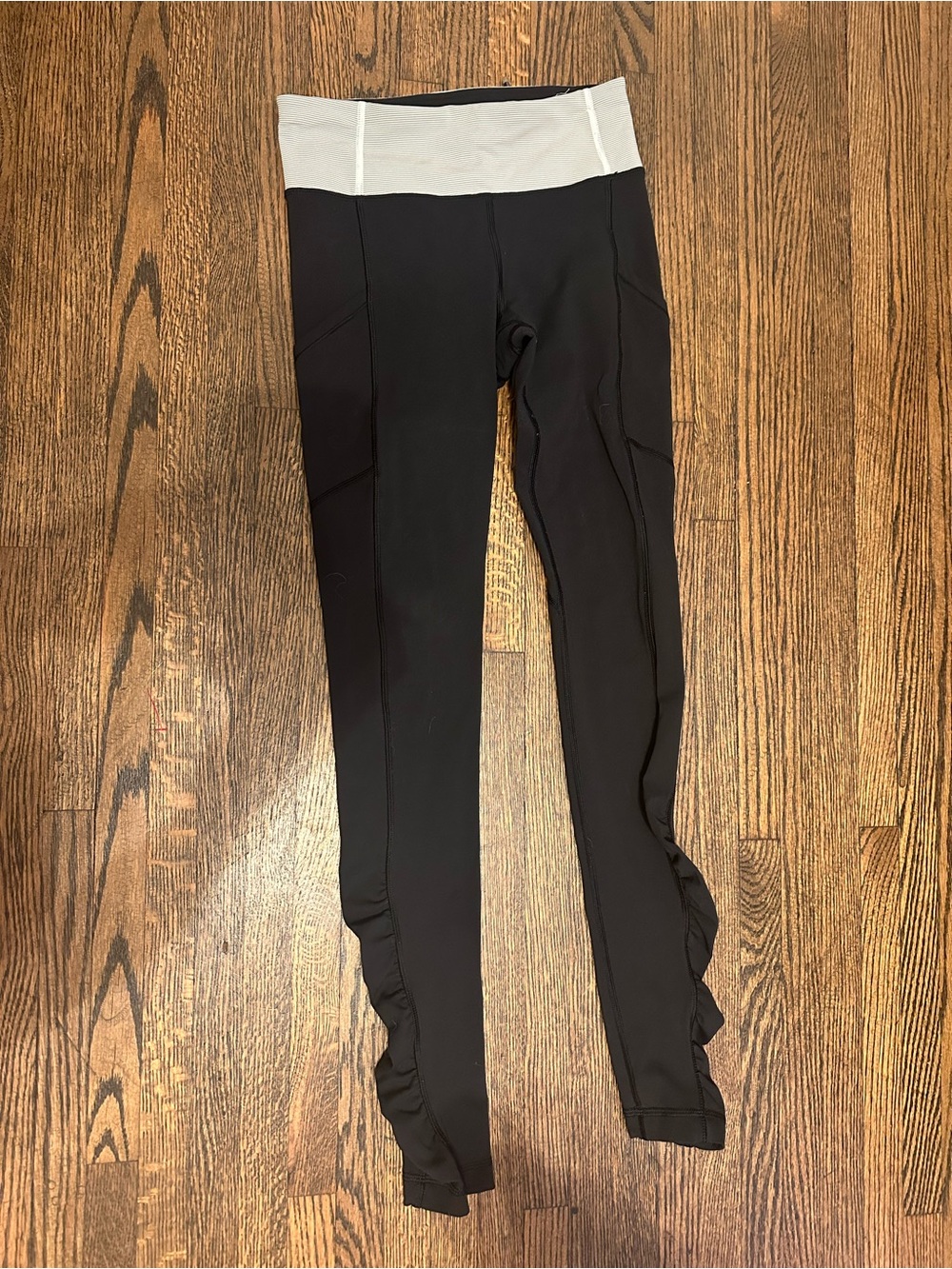 Lululemon Black Leggings with White Waistband and Ruffle Hem